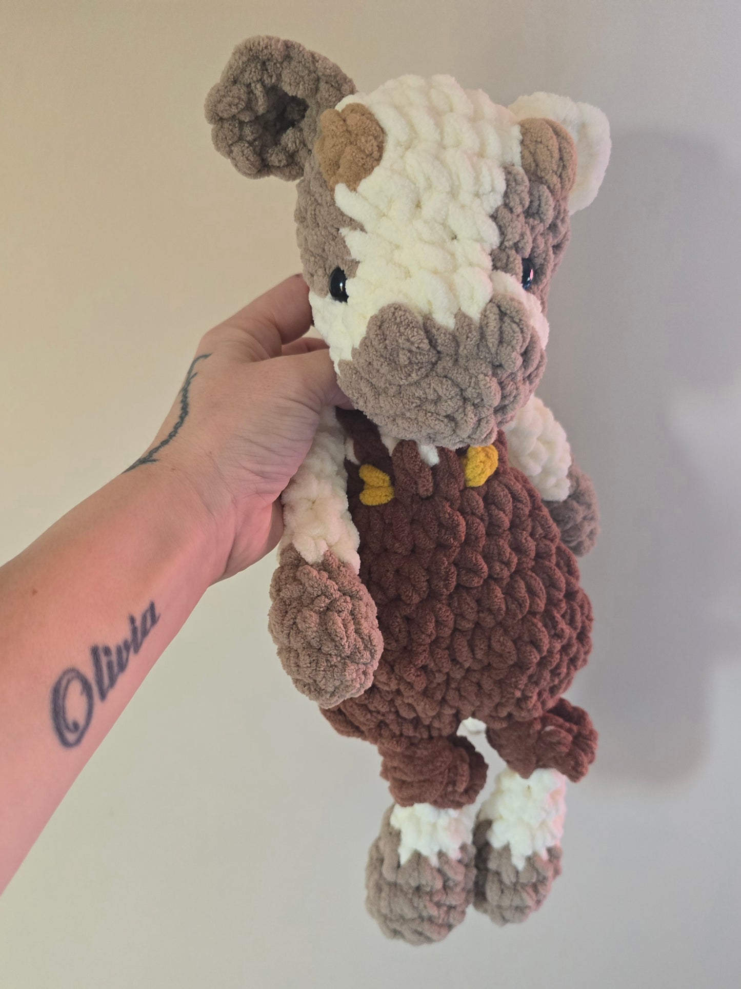 Cow Snuggler in dungarees