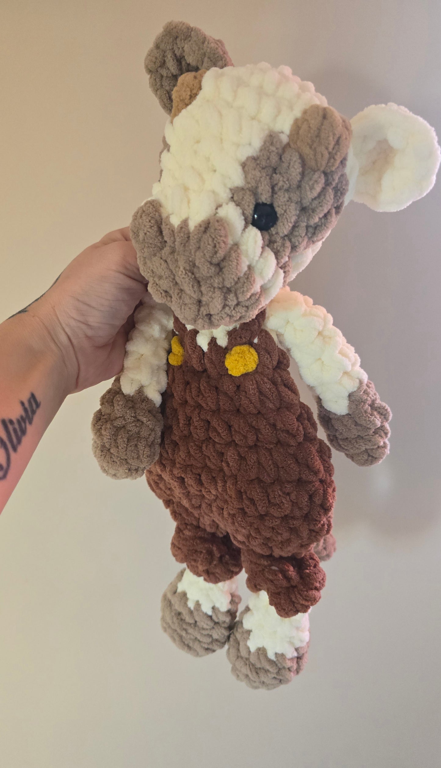 Cow Snuggler in dungarees